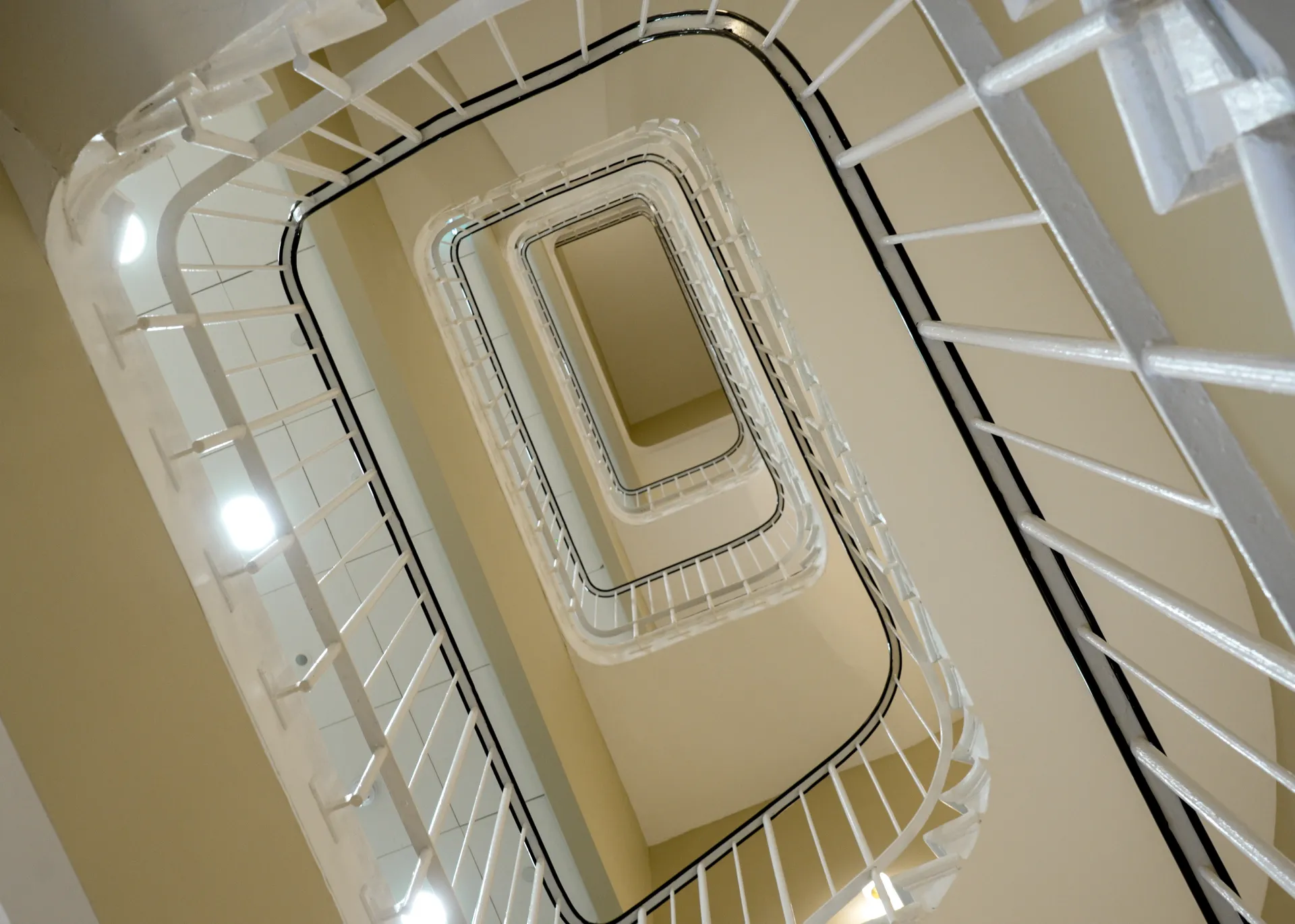 image looking up from the bottom of the spiral stairs